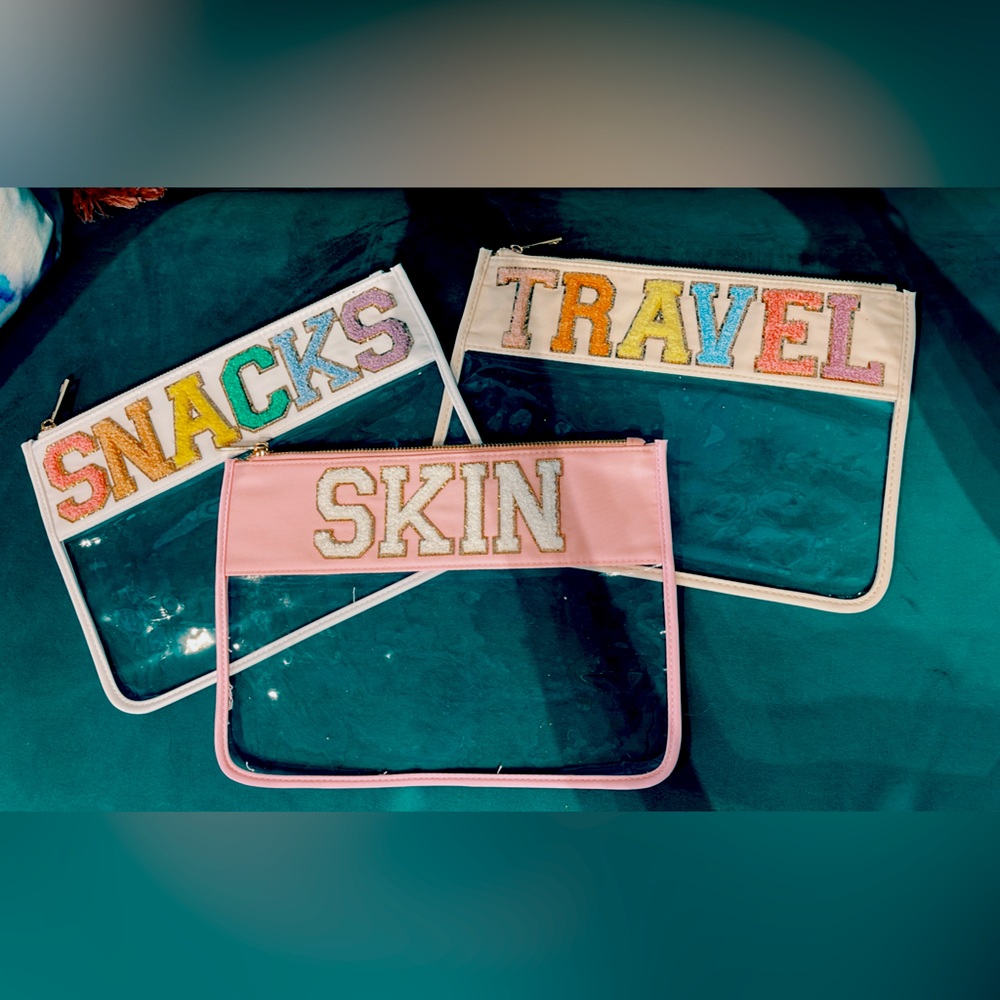BRAND NEW Clear, zipper pouch, water resistant with chenille lettering.